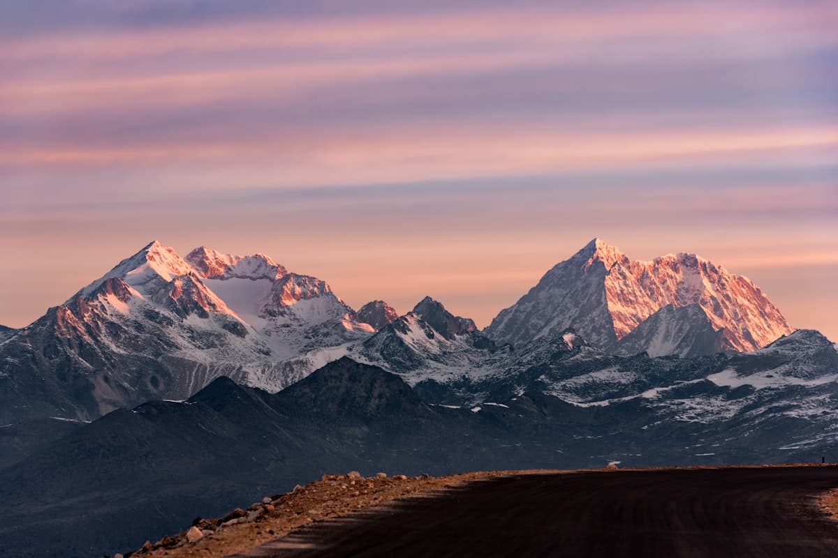 Panchachuli five peaks panoramic view above alpine meadows and rhododendron forests
